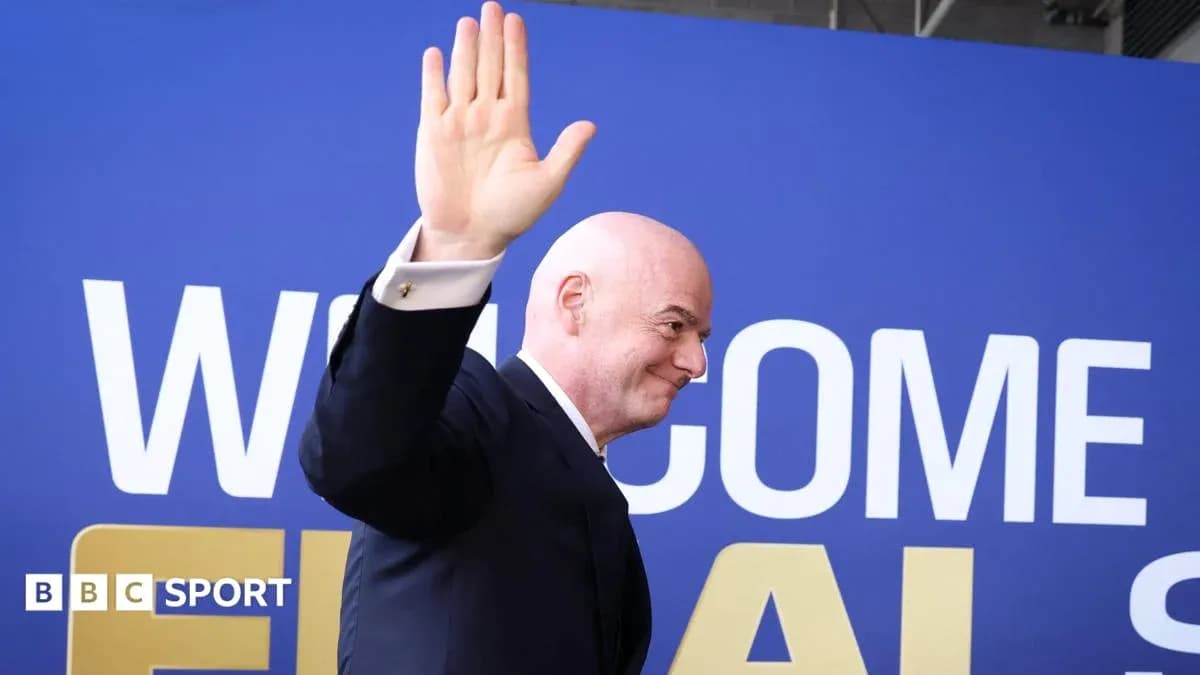 FIFA president waving at event backdrop FIFA president waving at event backdrop