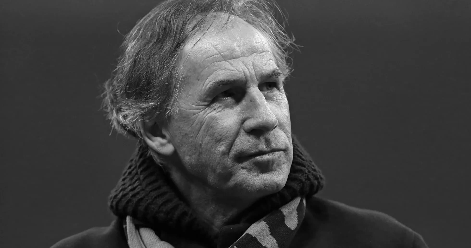 Man wearing a scarf, looking thoughtfully Man wearing a scarf, looking thoughtfully