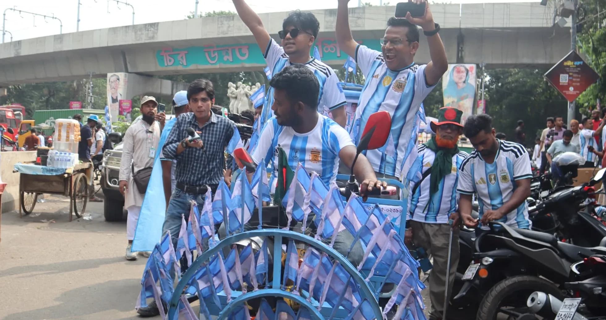 Fans celebrating with flags in street parade Fans celebrating with flags in street parade