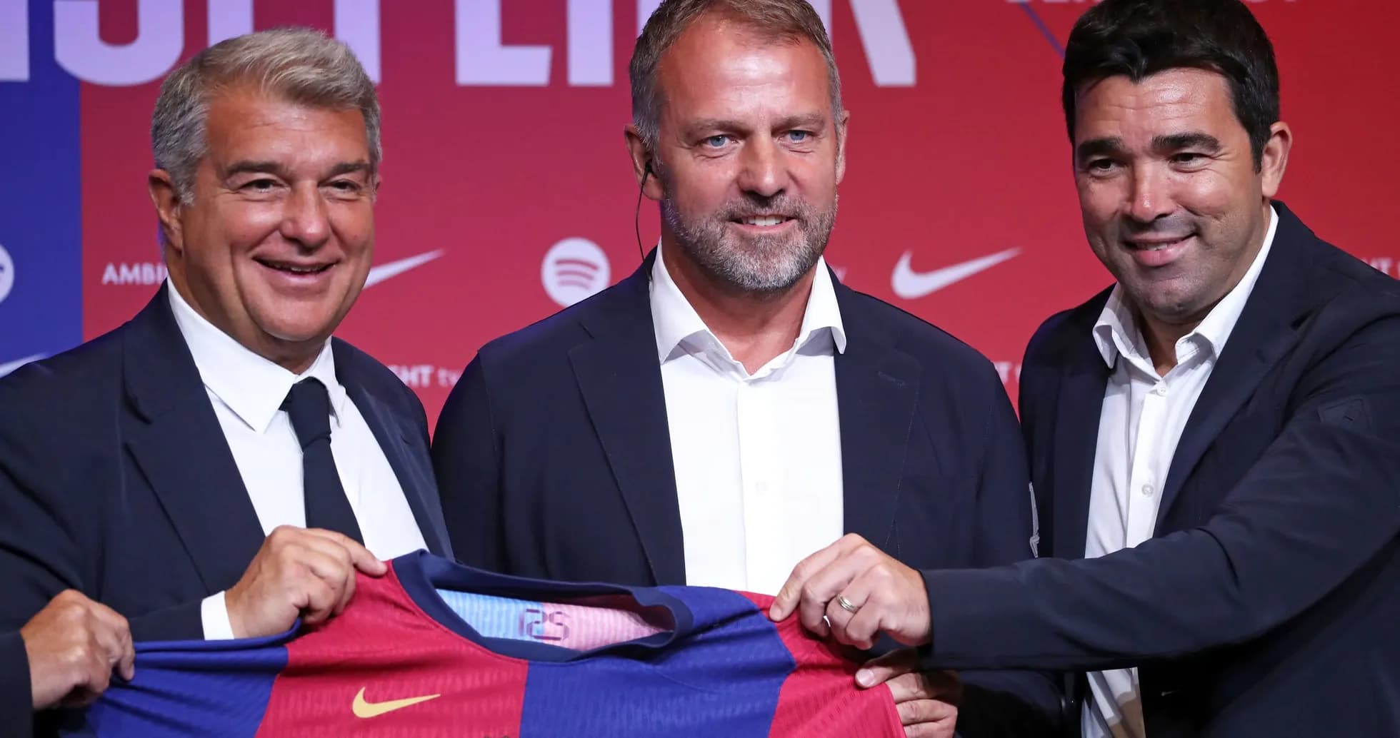 Officials presenting Barcelona jersey at press conference Officials presenting Barcelona jersey at press conference