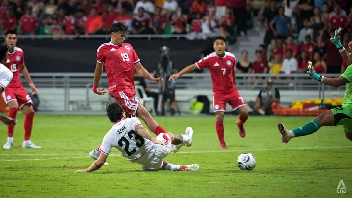 Player tackling opponent during football match action Player tackling opponent during football match action