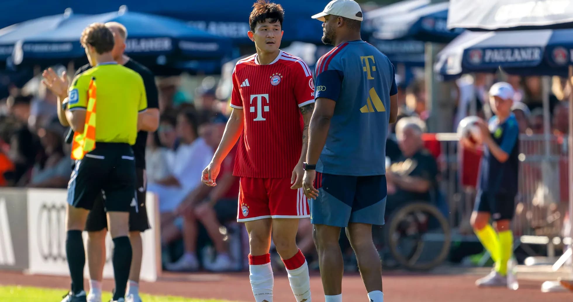 Bayern Munich player conversing with coach during match Bayern Munich player conversing with coach during match