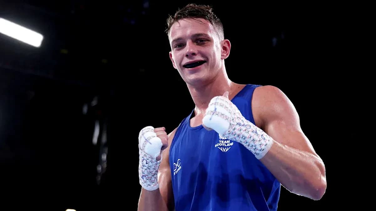 Boxer celebrating victory in blue outfit Boxer celebrating victory in blue outfit