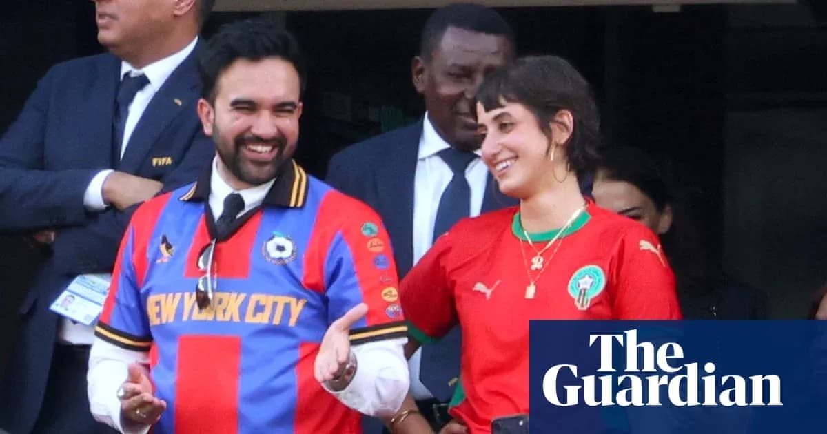 Two fans wearing soccer jerseys at event Two fans wearing soccer jerseys at event