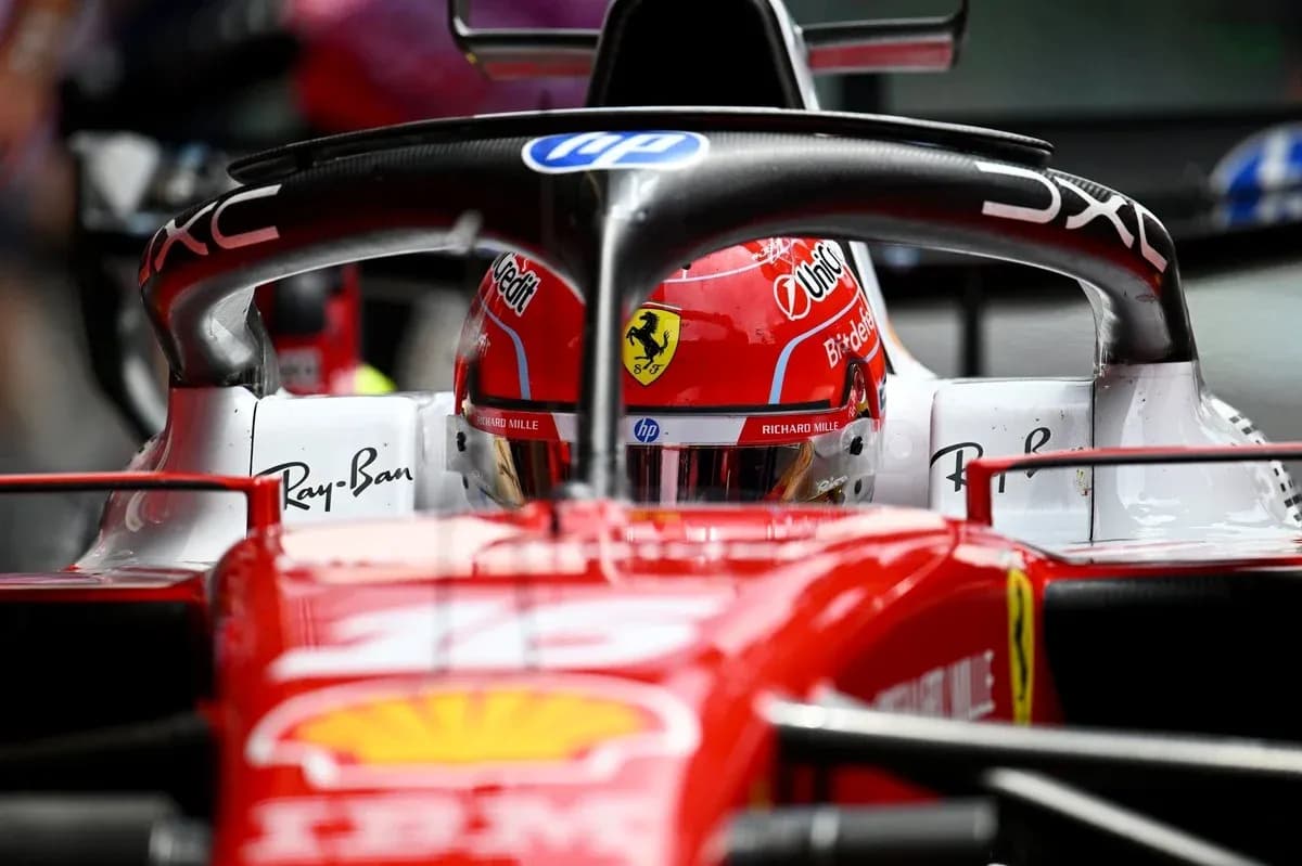 F1 driver in Ferrari car during race F1 driver in Ferrari car during race