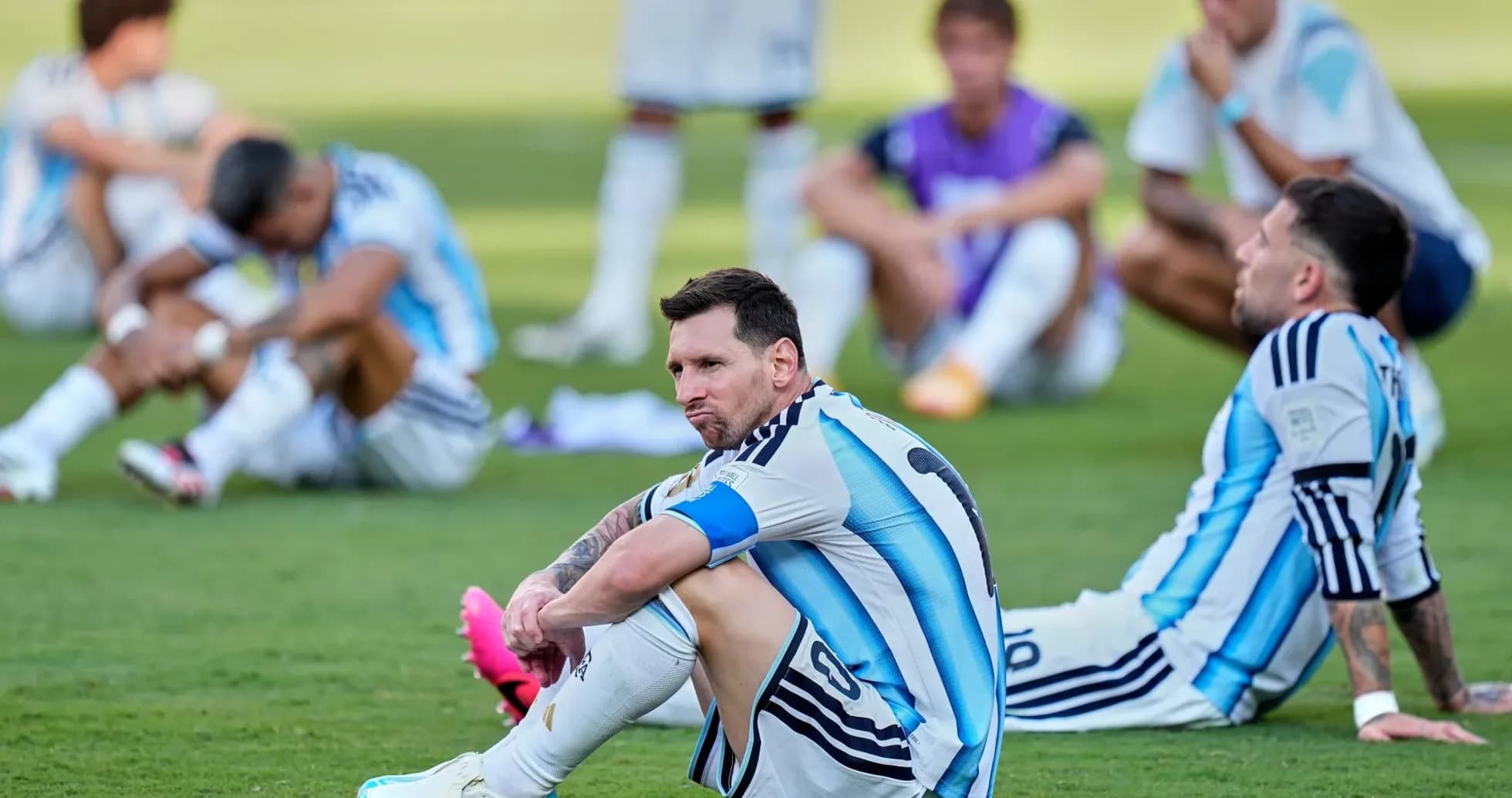Argentina players sitting on field after match Argentina players sitting on field after match