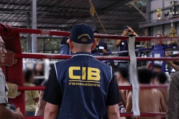 Inspector observing activities at boxing ring Inspector observing activities at boxing ring