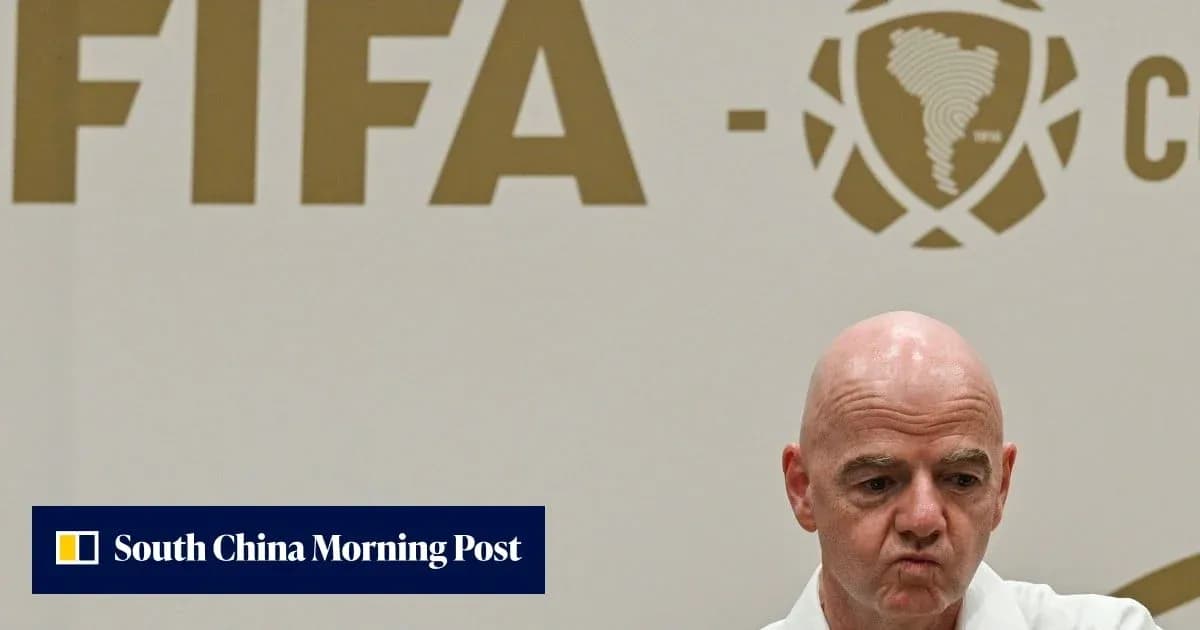 FIFA official at press conference with logo backdrop FIFA official at press conference with logo backdrop