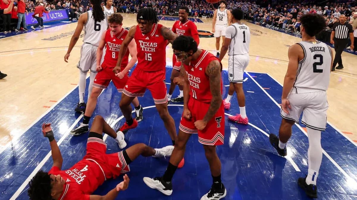 Texas Tech players celebrating after a successful play Texas Tech players celebrating after a successful play