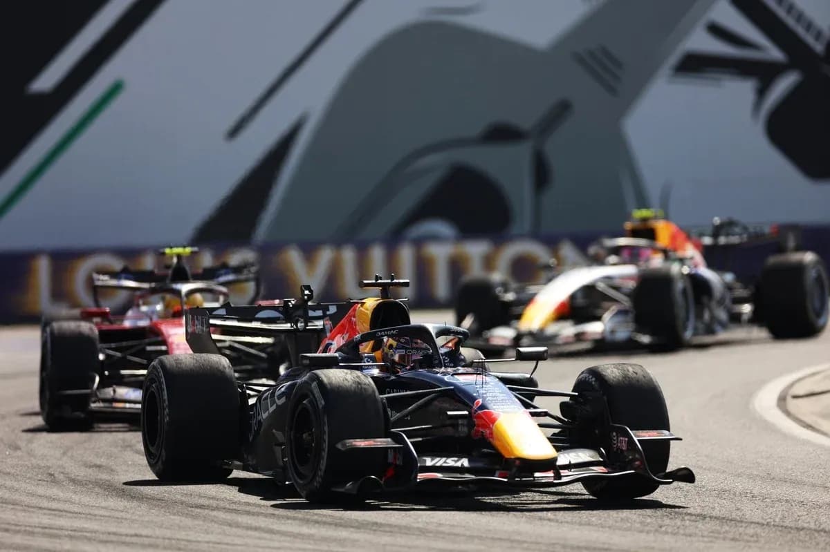 Formula 1 cars racing on track during event Formula 1 cars racing on track during event