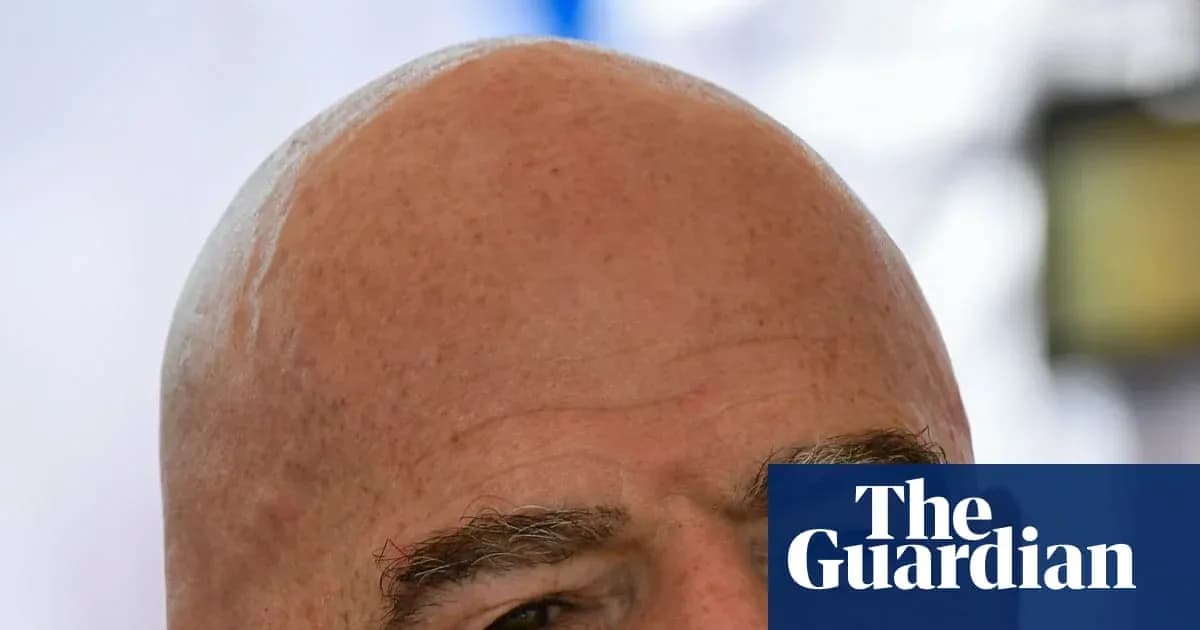 Bald man with prominent eyebrows and serious expression Bald man with prominent eyebrows and serious expression