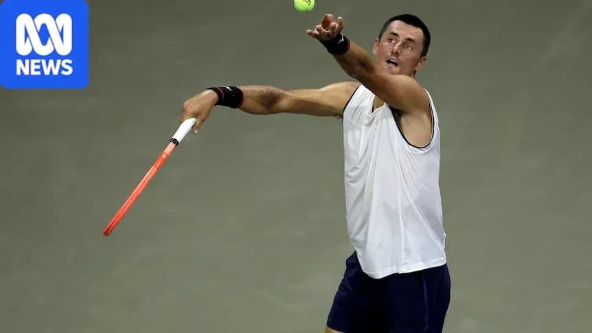 Tennis player serving during match Tennis player serving during match