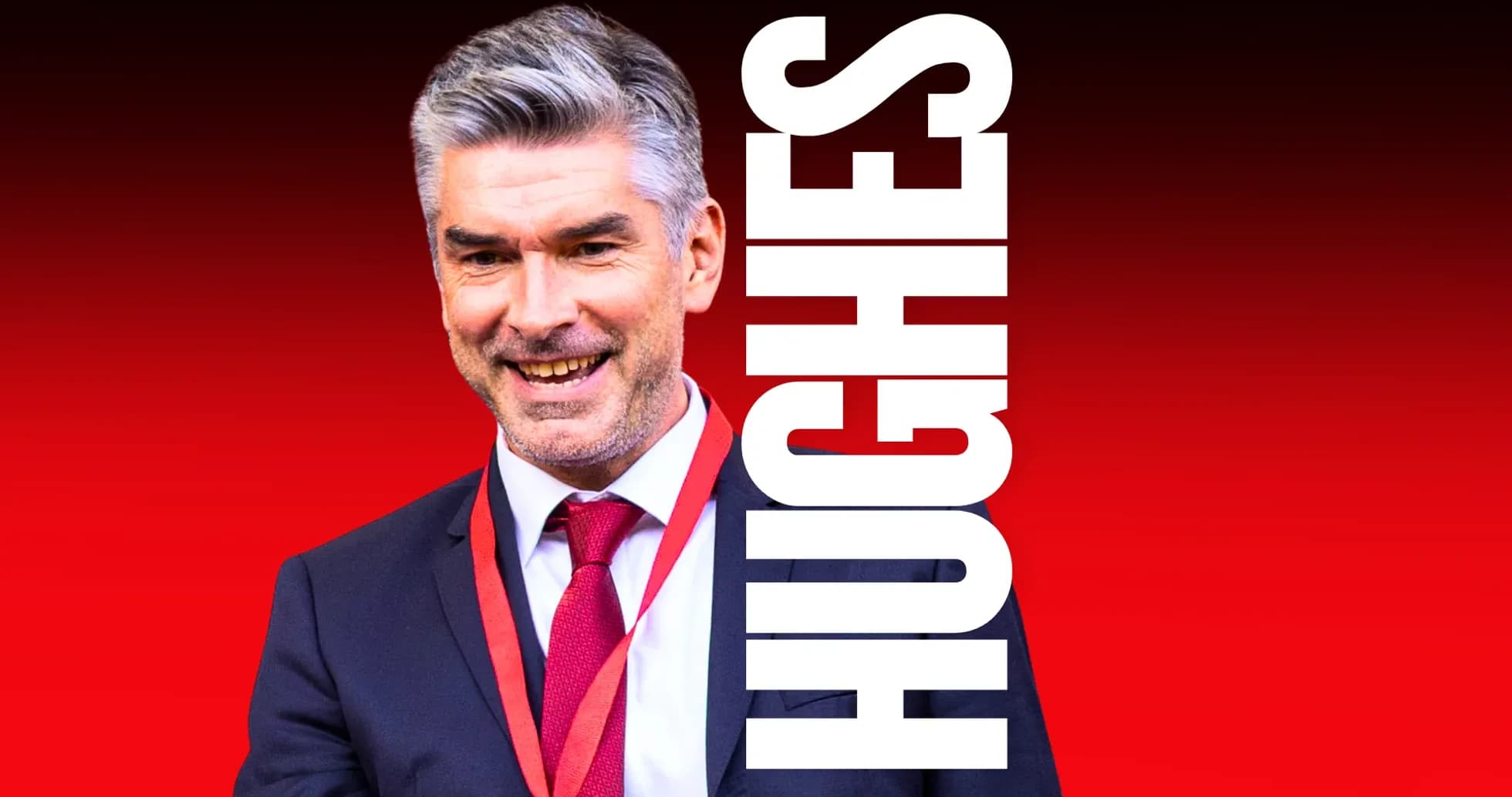 Coach smiling in suit with red background Coach smiling in suit with red background