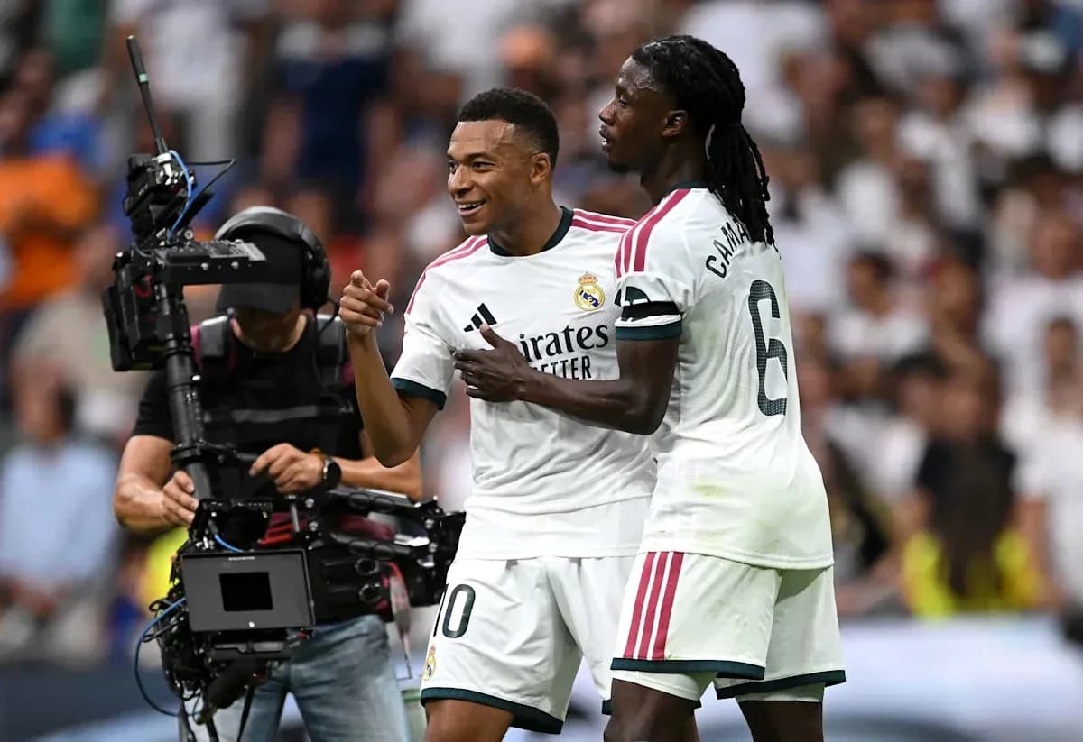 Mbappé and Camavinga celebrating on the pitch Mbappé and Camavinga celebrating on the pitch