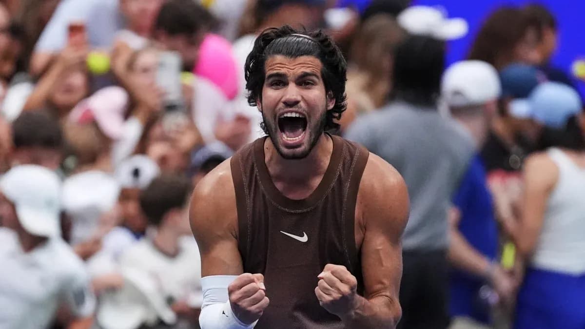 Tennis player celebrating victory with clenched fists Tennis player celebrating victory with clenched fists