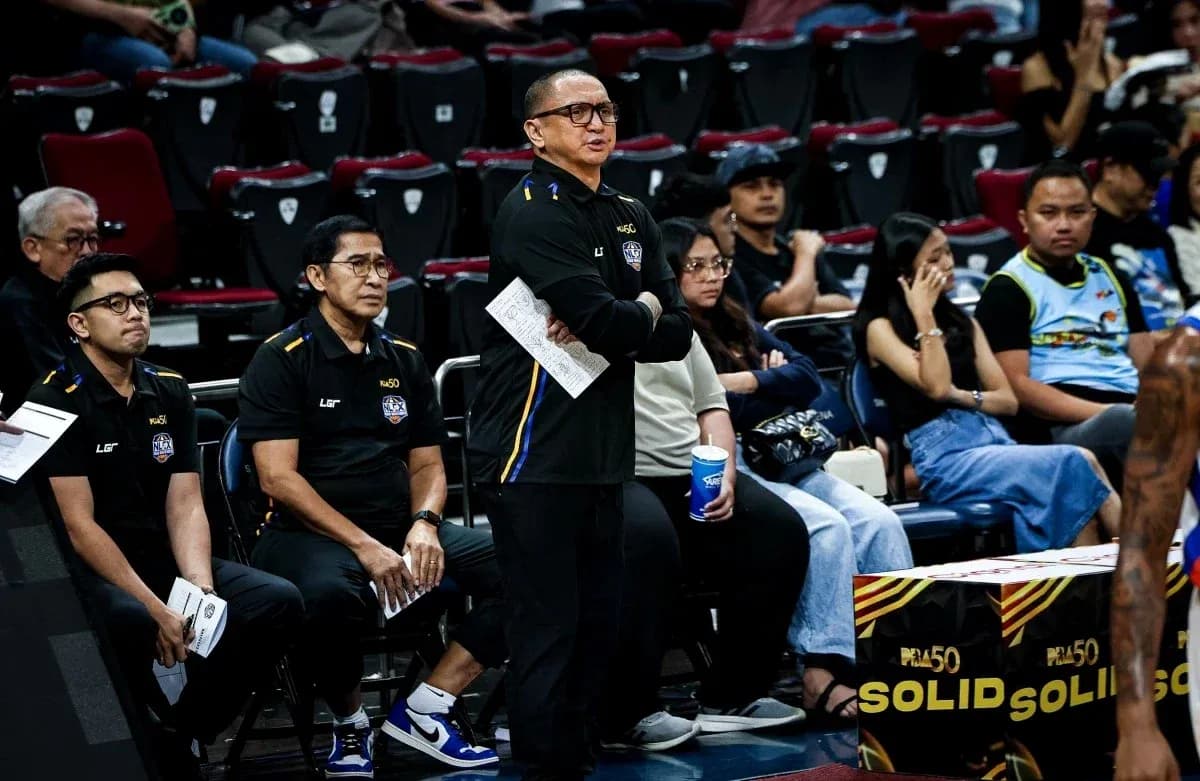 Coaching staff observing game from sidelines Coaching staff observing game from sidelines