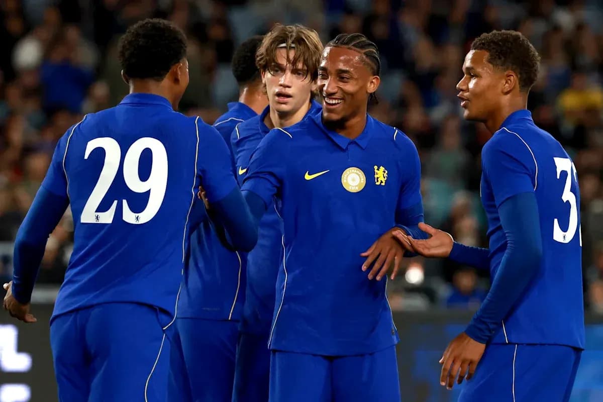 Chelsea players celebrating a goal together Chelsea players celebrating a goal together