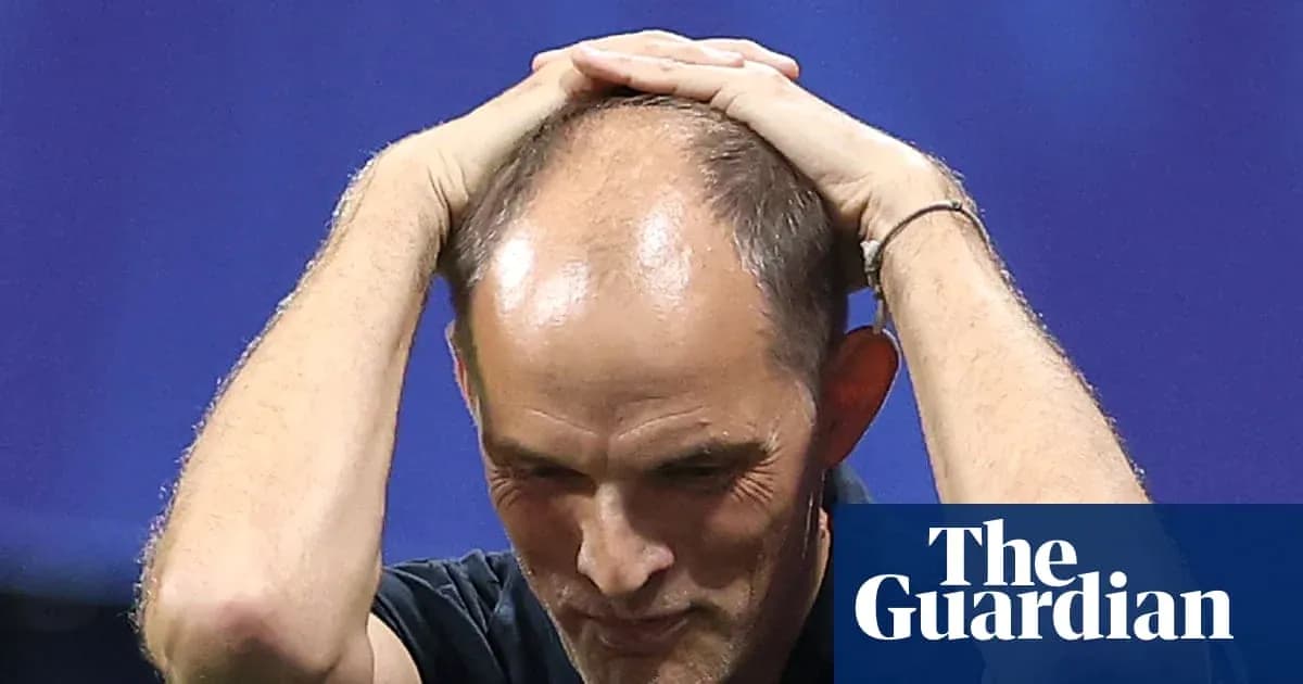 Football manager with hands on head during match Football manager with hands on head during match