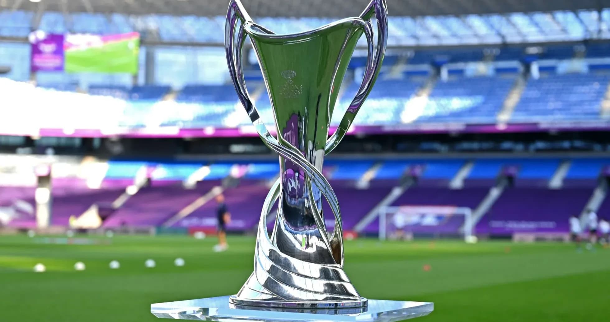 Trophy displayed on pitch before football match Trophy displayed on pitch before football match