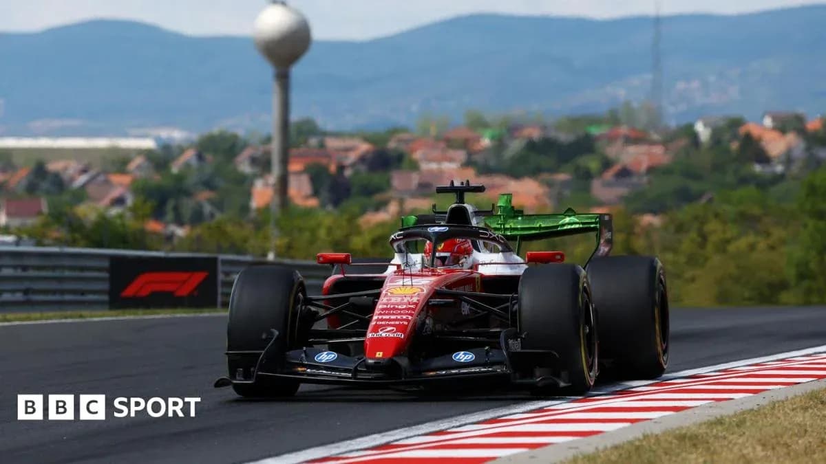 Formula 1 car racing on track with hills in background Formula 1 car racing on track with hills in background