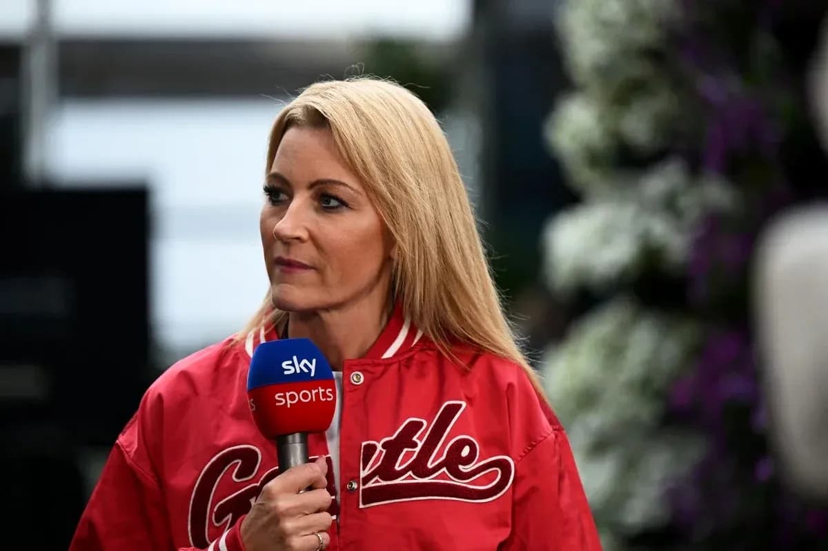 Television presenter speaking with microphone in hand Television presenter speaking with microphone in hand