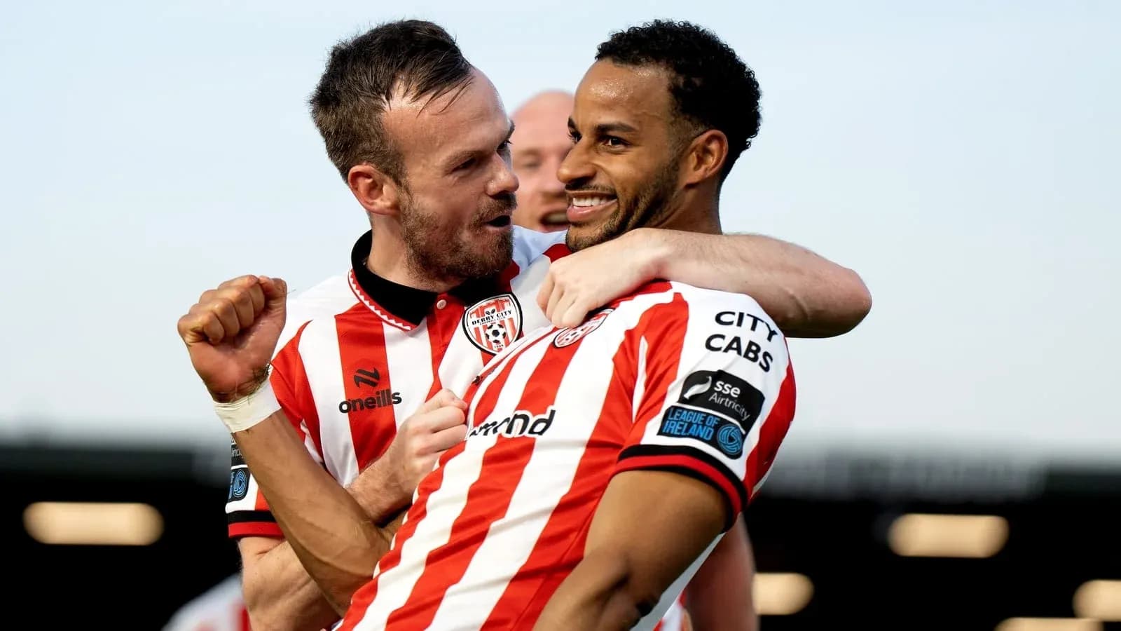 Derry City players celebrating a goal together Derry City players celebrating a goal together