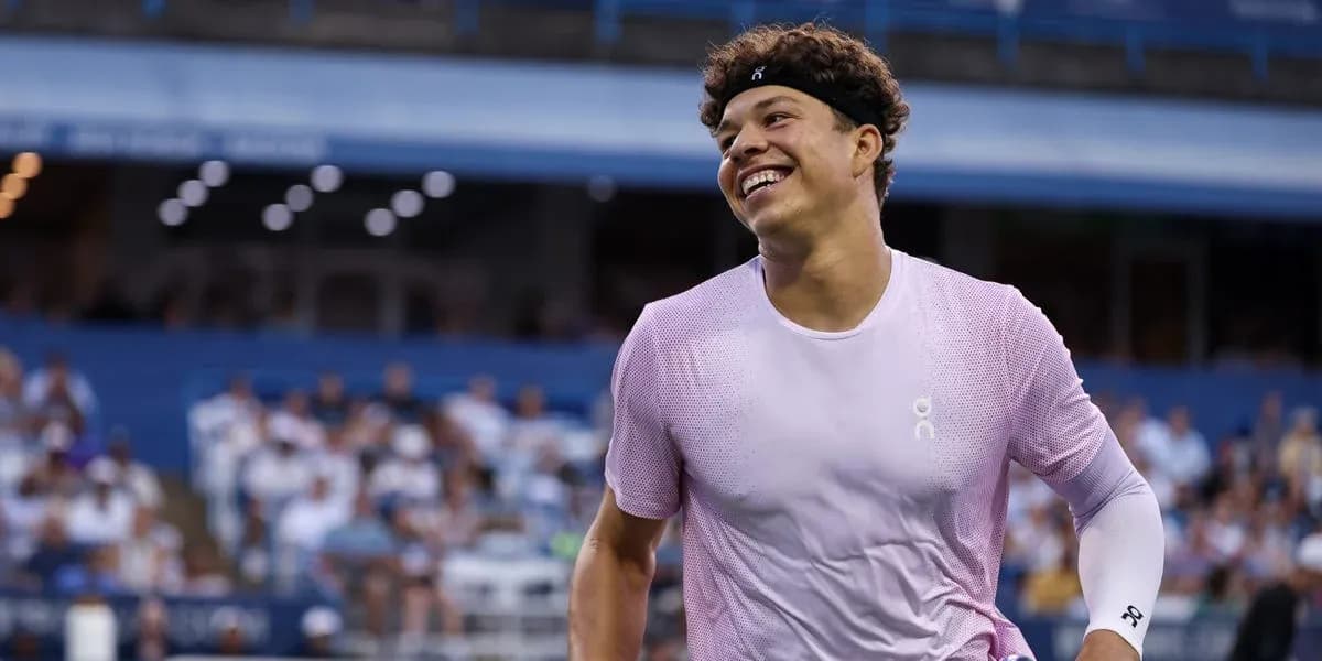 Tennis player smiling during a match Tennis player smiling during a match