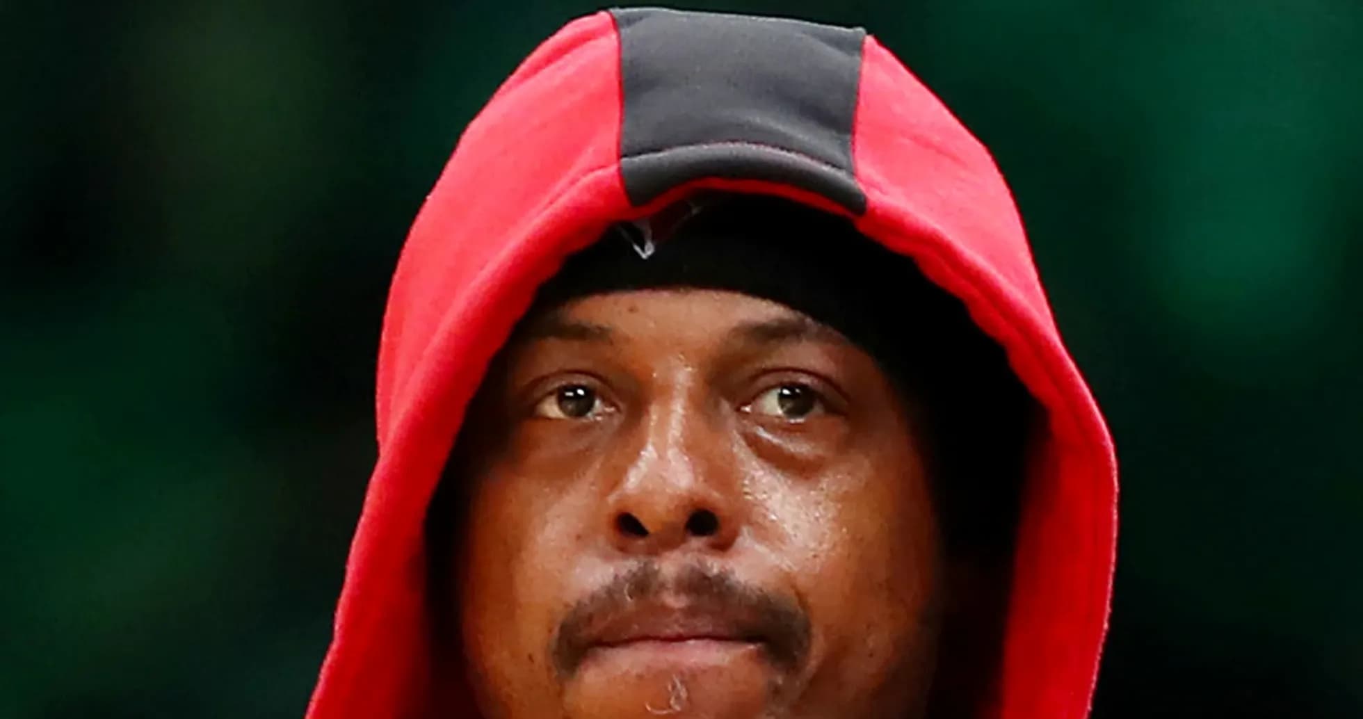 Basketball player wearing a red hoodie, focused Basketball player wearing a red hoodie, focused