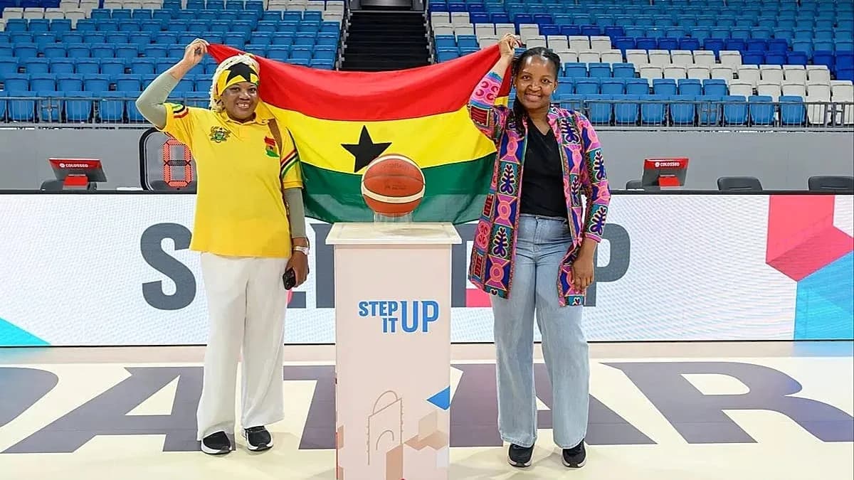 Two women holding Ghana flag with basketball Two women holding Ghana flag with basketball
