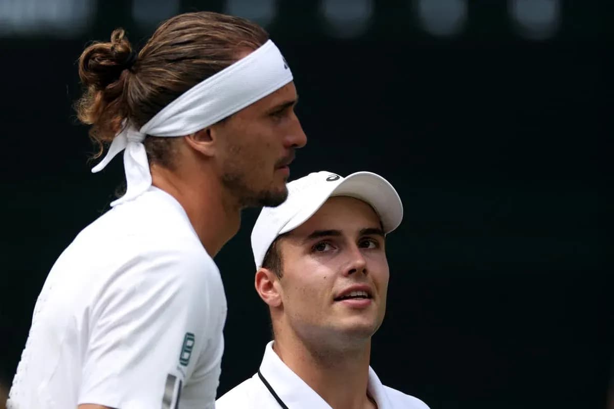 Tennis players discussing strategy during match Tennis players discussing strategy during match