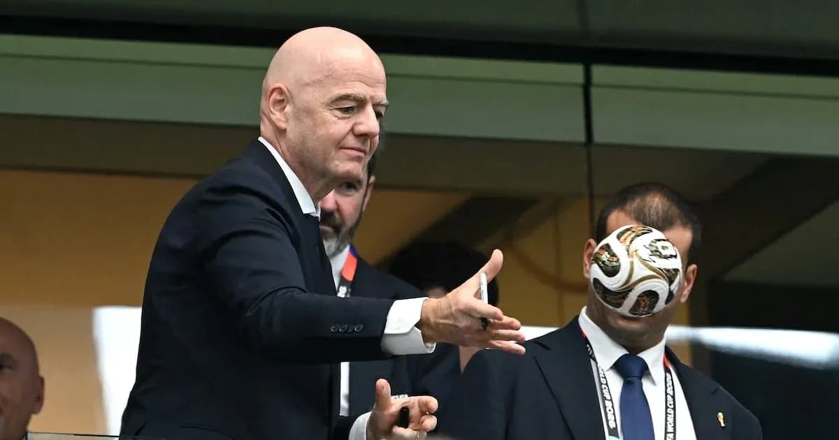 FIFA president throwing a football in a box FIFA president throwing a football in a box