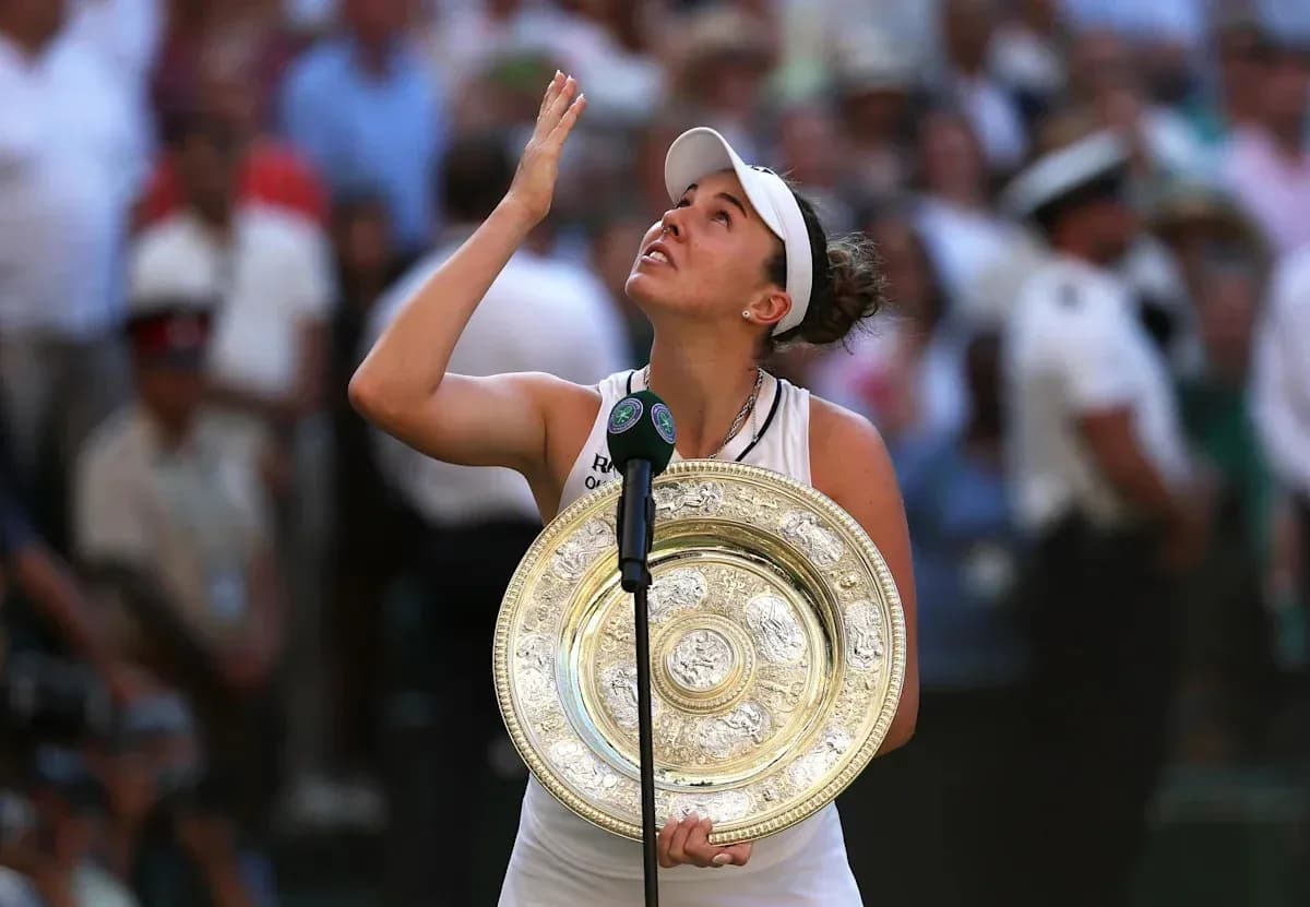Tennis player holding trophy after winning Wimbledon Tennis player holding trophy after winning Wimbledon