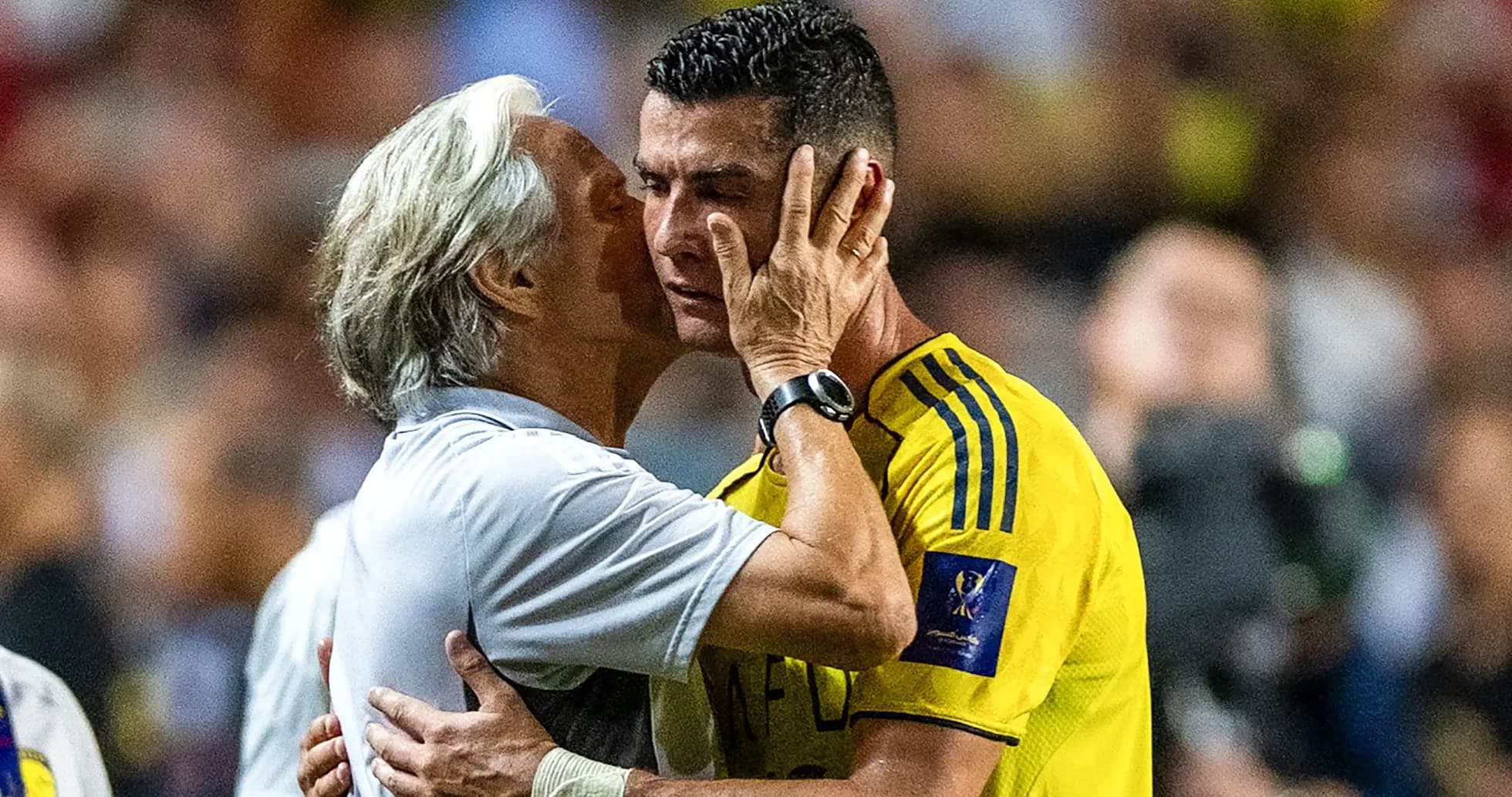 Coach and player embracing after match Coach and player embracing after match