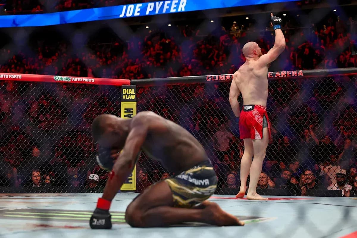 Joe Pyfer celebrating victory in UFC octagon Joe Pyfer celebrating victory in UFC octagon