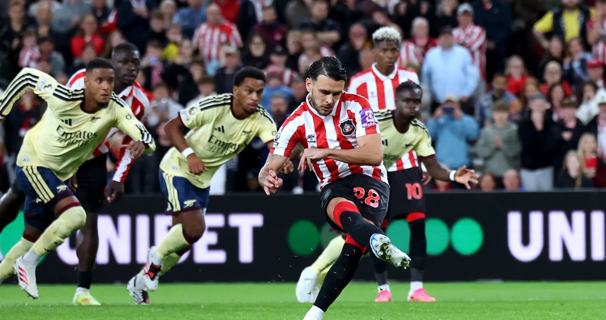 Player taking a penalty kick during the match Player taking a penalty kick during the match