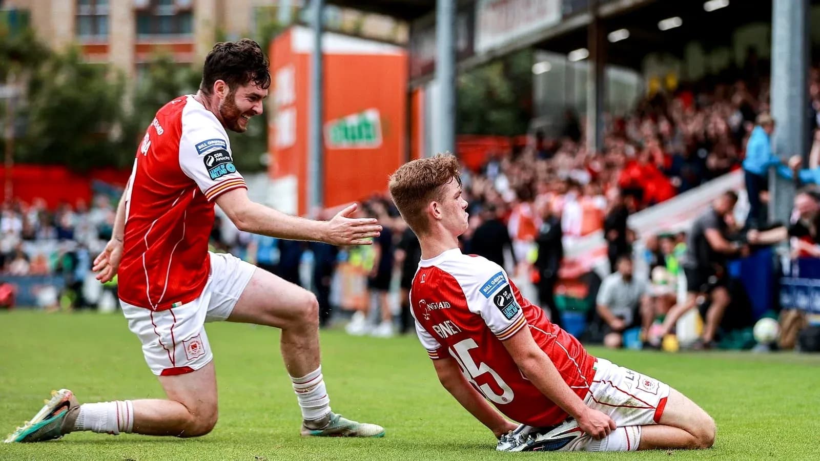 Player celebrating a goal on the pitch Player celebrating a goal on the pitch