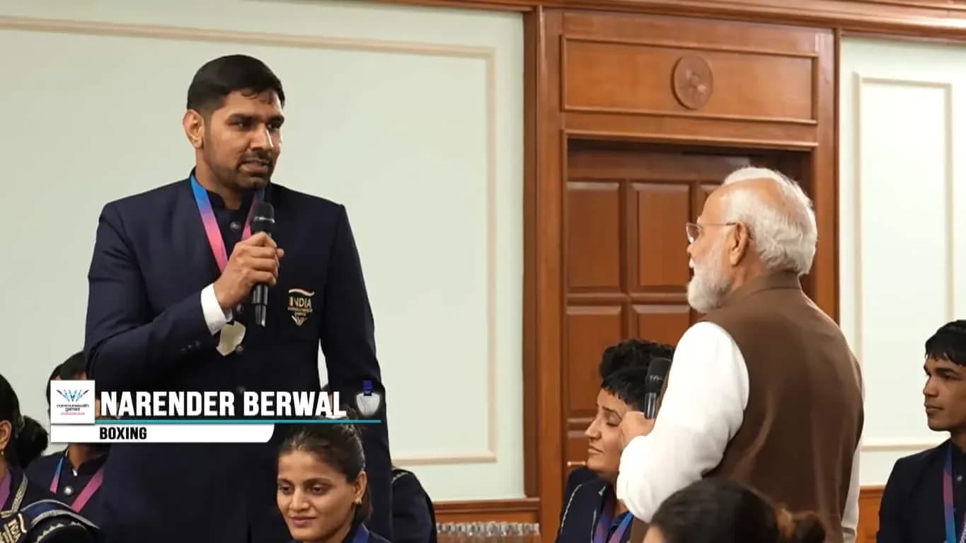 Narender Berwal speaking at event with attendees Narender Berwal speaking at event with attendees