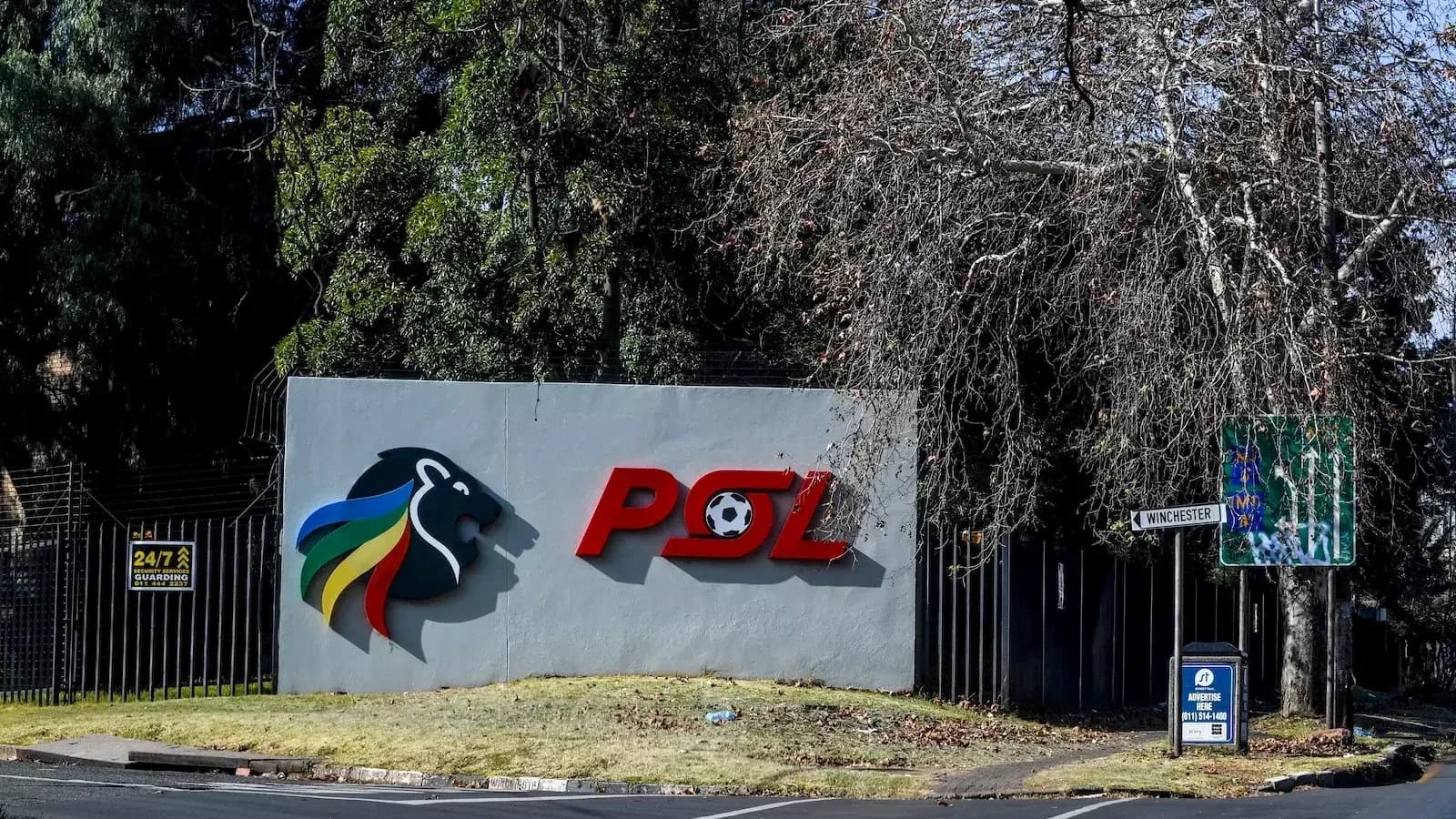 PSL logo on wall with street sign nearby PSL logo on wall with street sign nearby