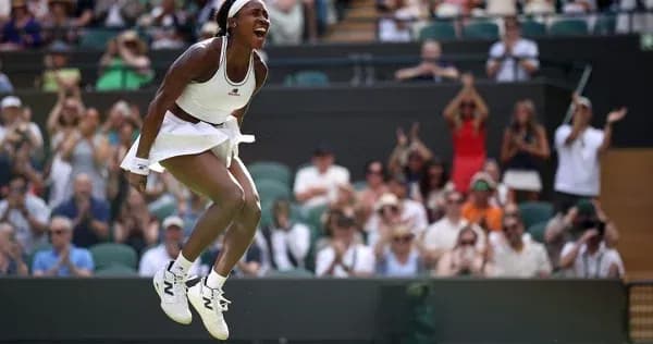 Tennis player celebrating during Wimbledon match Tennis player celebrating during Wimbledon match