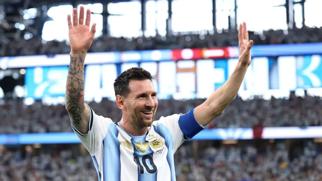 Lionel Messi waving to fans during a match Lionel Messi waving to fans during a match