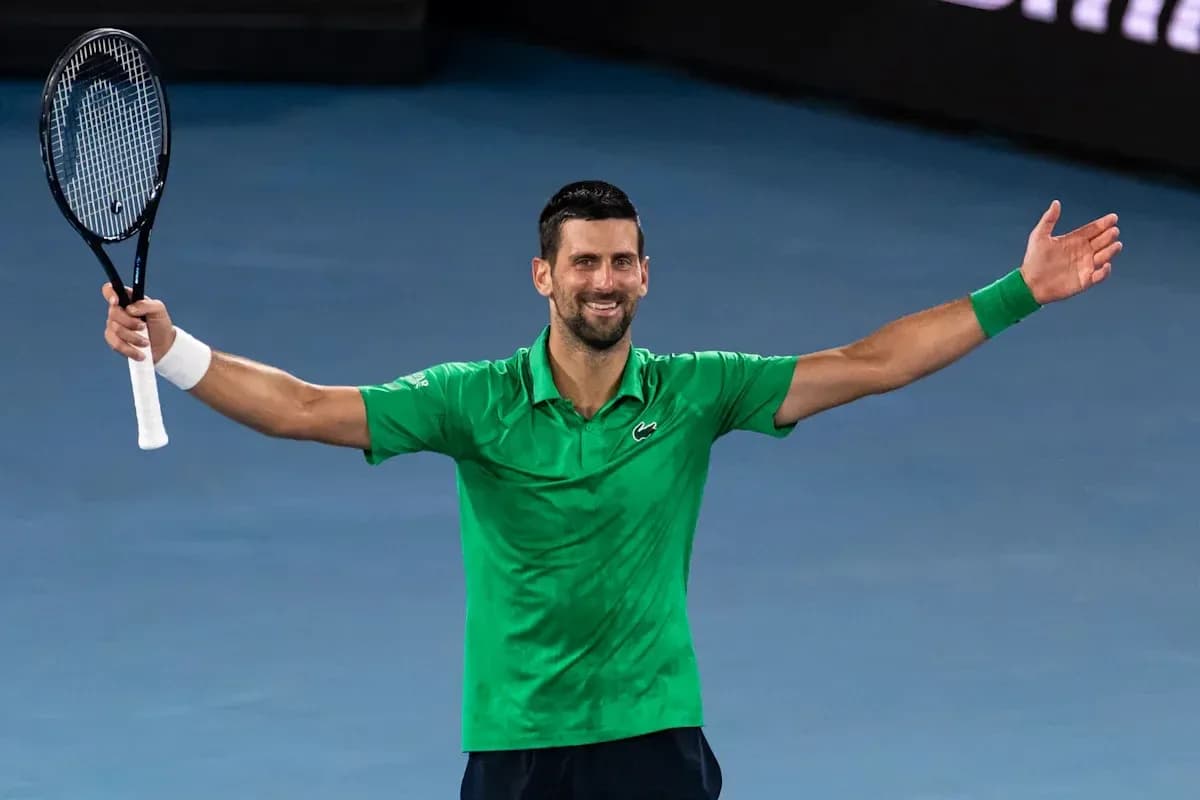 Tennis player celebrating after a match victory Tennis player celebrating after a match victory
