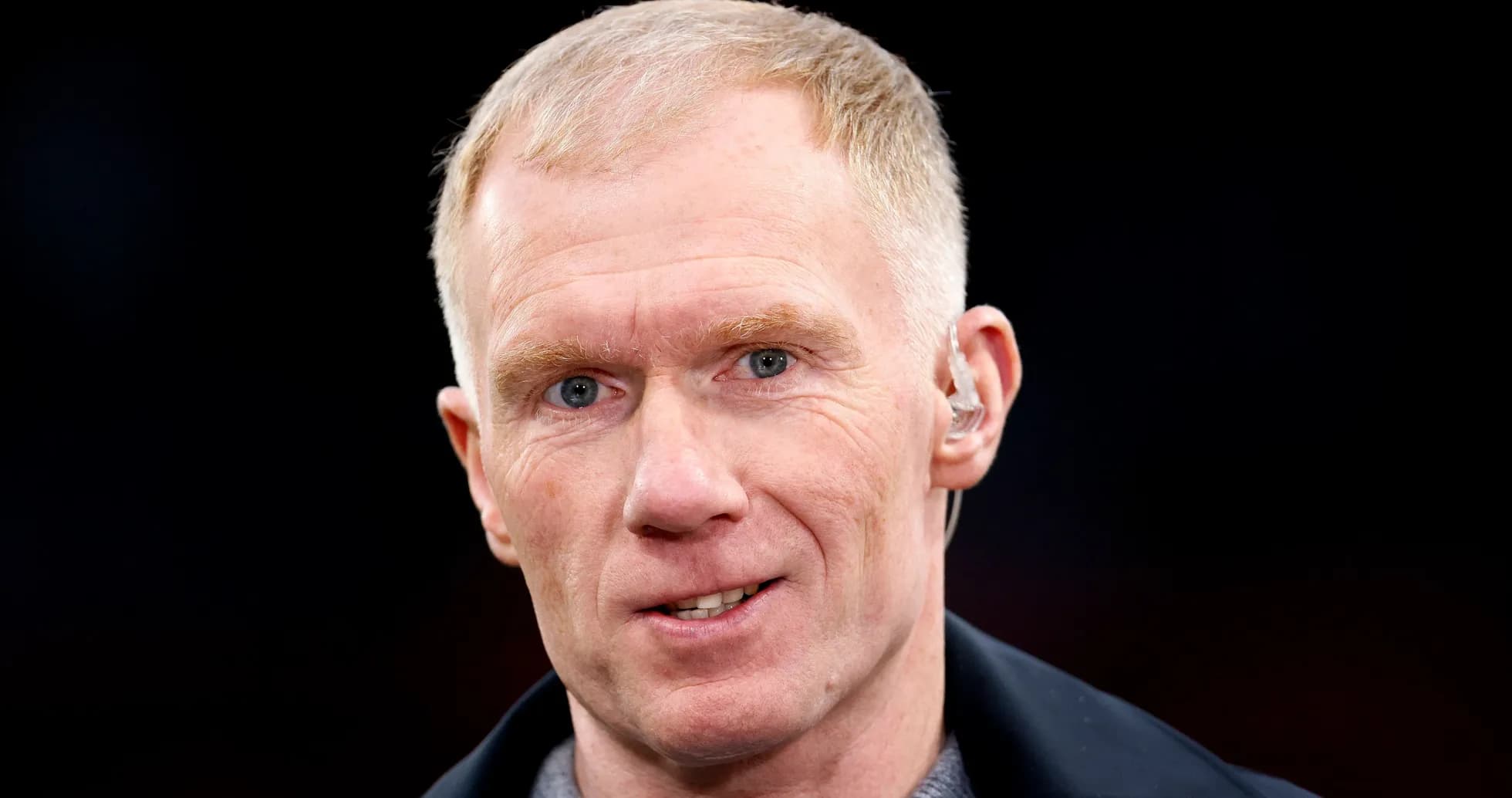 Man with short hair speaking into microphone Man with short hair speaking into microphone