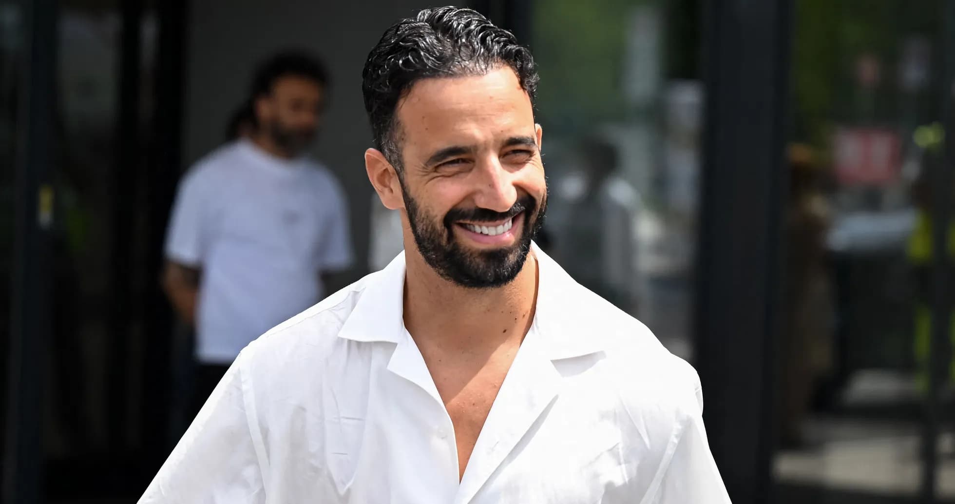 Football player smiling while walking outdoors Football player smiling while walking outdoors