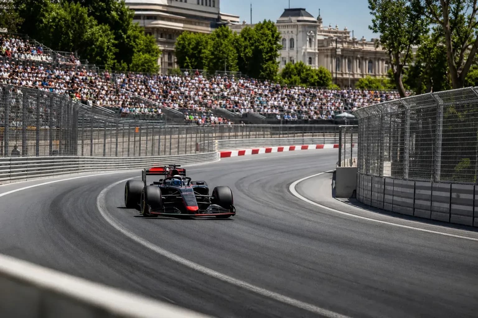 Formula 1 car navigating a curve on the track Formula 1 car navigating a curve on the track