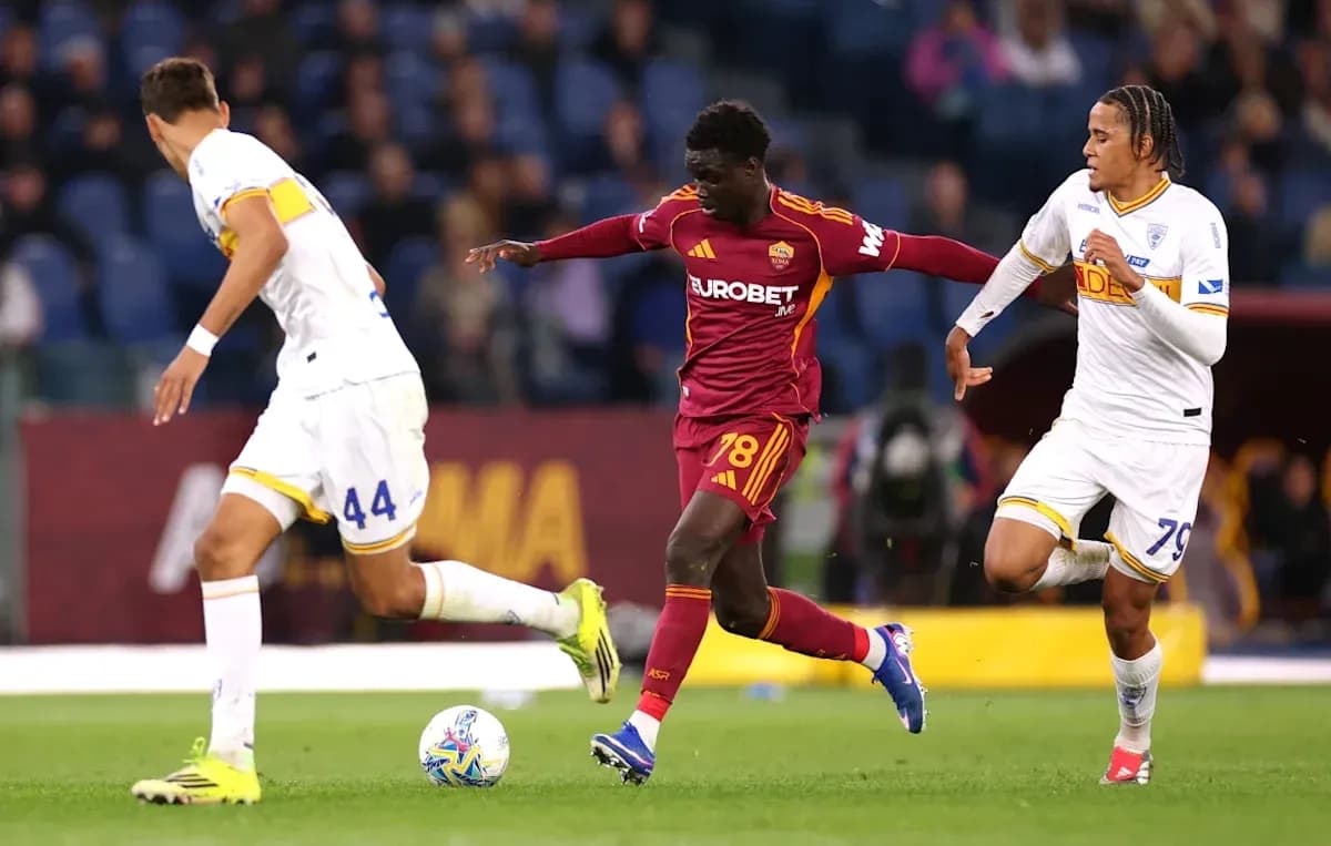 AS Roma player dribbling past two defenders AS Roma player dribbling past two defenders