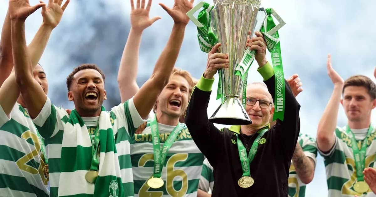 Celtic players celebrating with trophy on stage Celtic players celebrating with trophy on stage