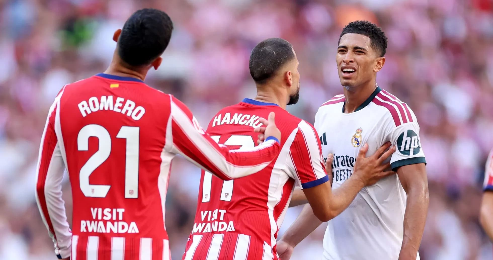 Atletico players confronting Real Madrid player during match Atletico players confronting Real Madrid player during match