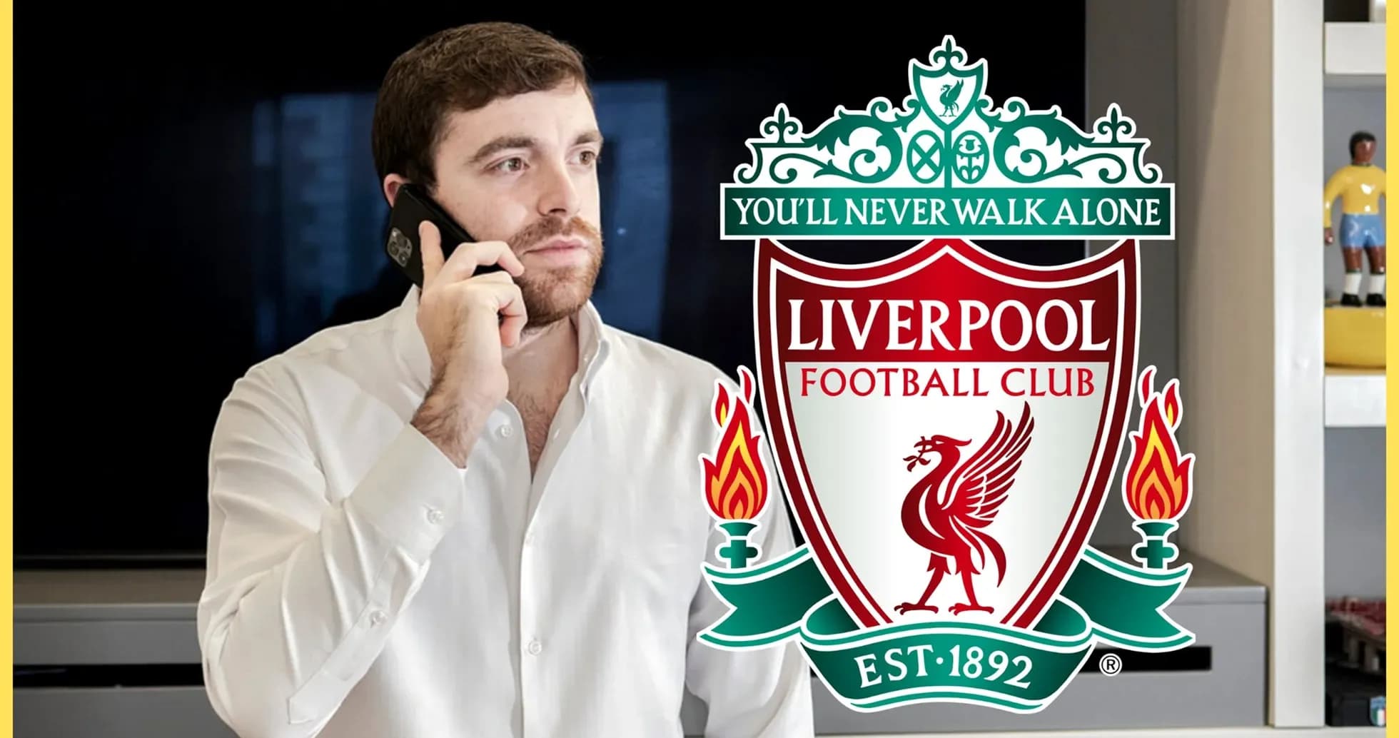 Man speaking on phone with Liverpool FC logo Man speaking on phone with Liverpool FC logo