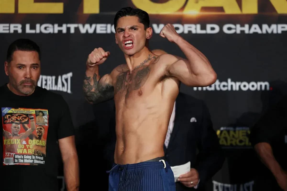 Boxer posing during weigh-in event with opponent Boxer posing during weigh-in event with opponent