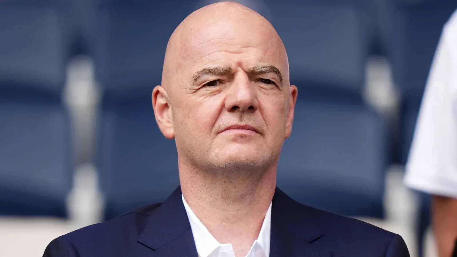 FIFA president seated in stadium before event FIFA president seated in stadium before event